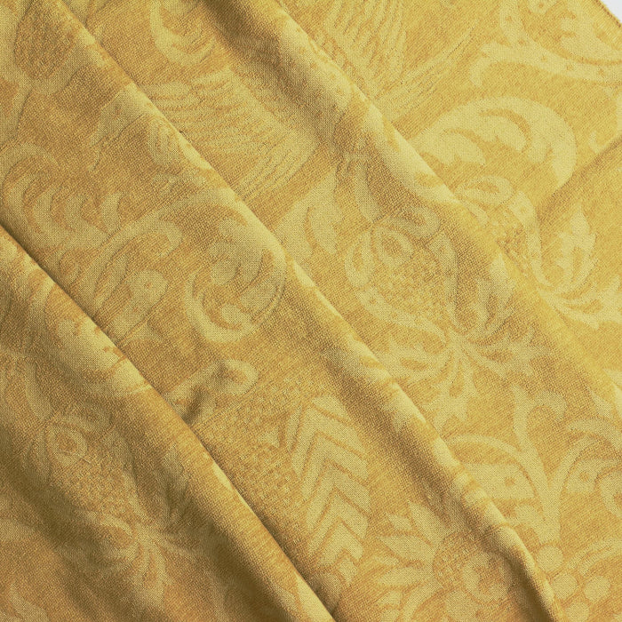 Gold bird print home décor chenille fabric folded