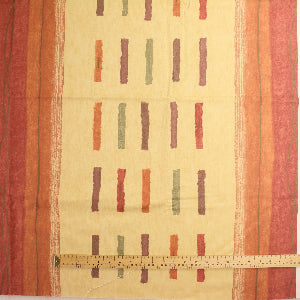 Red, orange and gold home décor canvas fabric laid flat