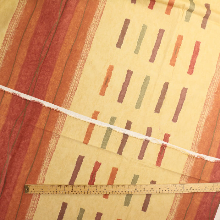 Red, orange and gold home décor canvas fabric laid flat detail