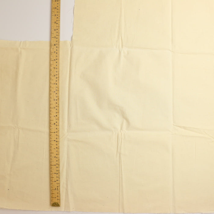 Unbleached medium weight calico fabric laid flat