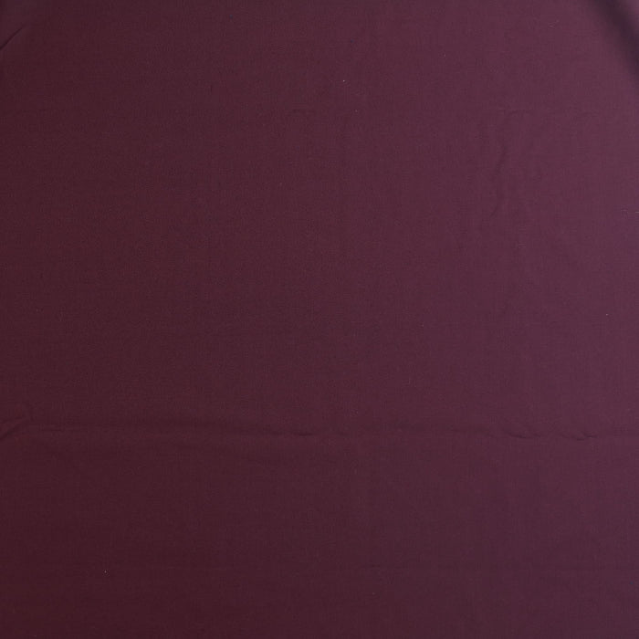 Burgundy polyester viscose twill fabric laid flat