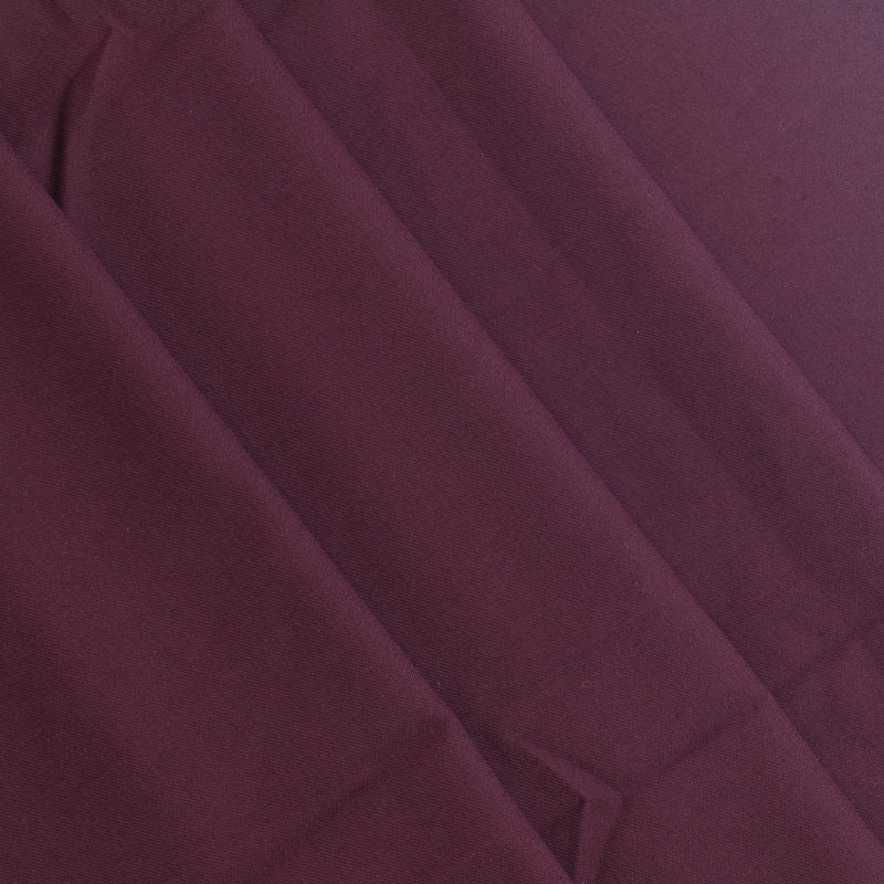 Burgundy polyester viscose twill fabric folded