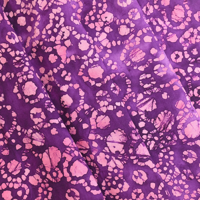 Purple and pink batik cotton fabric folded
