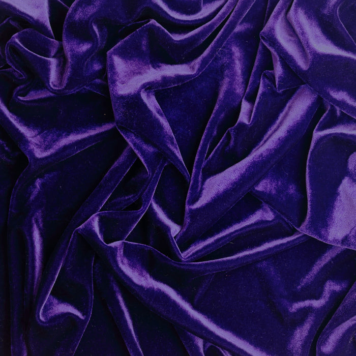 Deep purple crushed velvet fabric showing drape