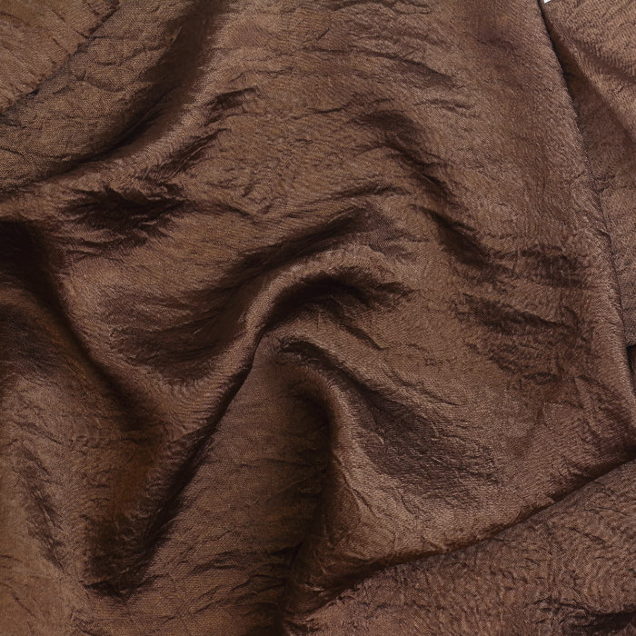 Brown faux silk crushed dupion fabric remnant showing texture