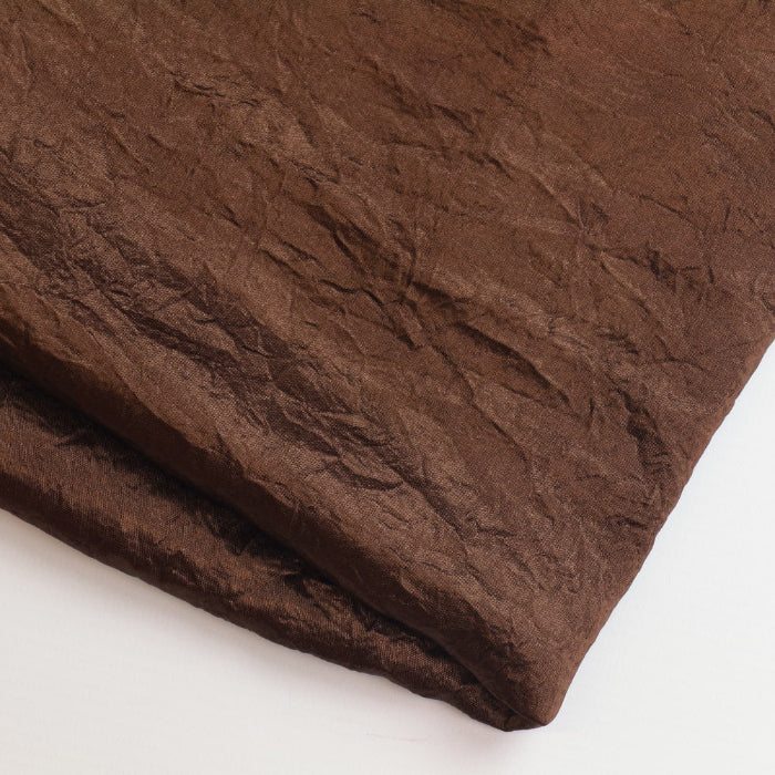 Brown faux silk crushed dupion fabric remnant folded showing detail