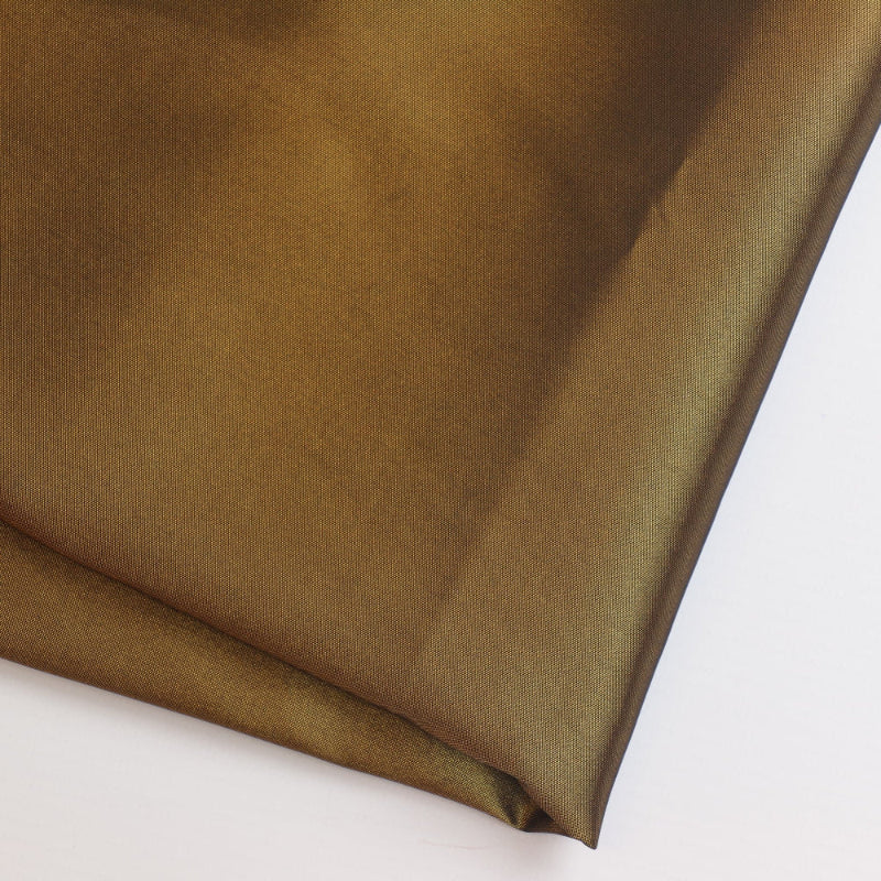 Bronze faux silk shantung fabric folded showing texture and detail