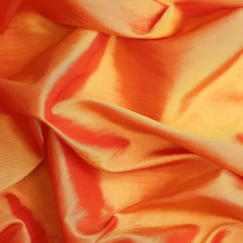 Orange gold faux silk shantung fabric showing drape