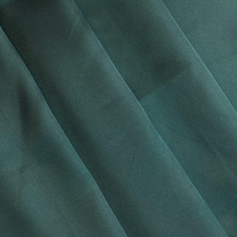 Deep green polyester satin fabric folded