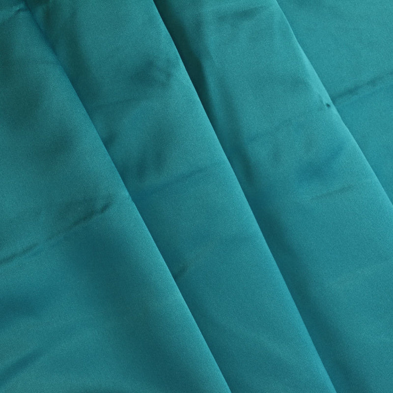 Peacock teal satin fabric folded