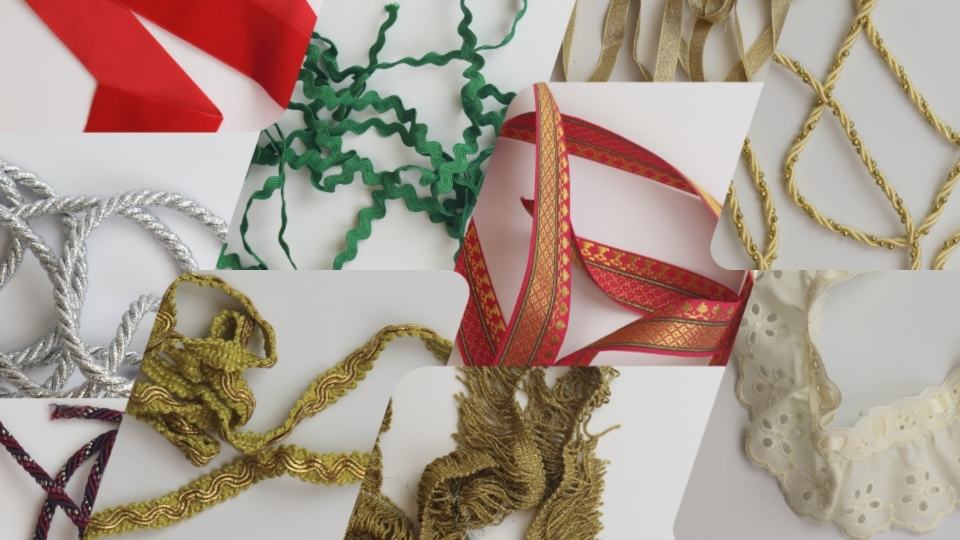 Collection of decorative ribbons and lace on a white background